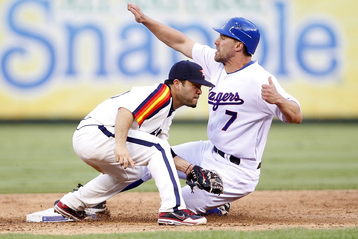 ARLINGTON, TX - JUNE 16: David Murphy #7 of the Texas Rangers steals second base beating the tag by Jose Altuve #27 of the Houston Astros at Rangers Ballpark in Arlington on June 16, 2012 in Arlington, Texas. (Photo by Rick Yeatts/Getty Images)
