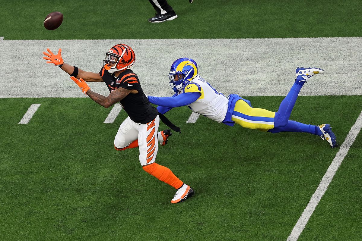 Ja’Marr Chase #1 of the Cincinnati Bengals makes a catch over Jalen Ramsey #5 of the Los Angeles Rams during Super Bowl LVI at SoFi Stadium on February 13, 2022 in Inglewood, California.