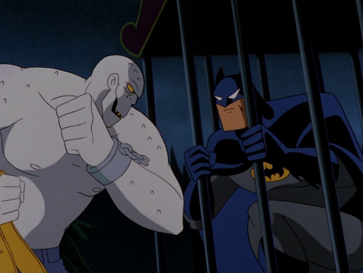 Killer Croc taunting Batman in a cage in “Sideshow” from Batman: The Animated Series.