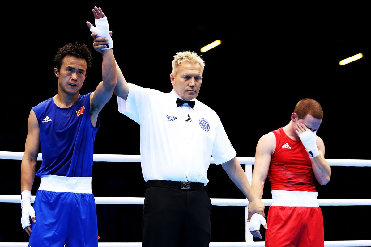 Lightweight Qiang Liu of China faces Cuba's Yasnier Toledo this morning in London during round of 16 action. (Photo by Scott Heavey/Getty Images)