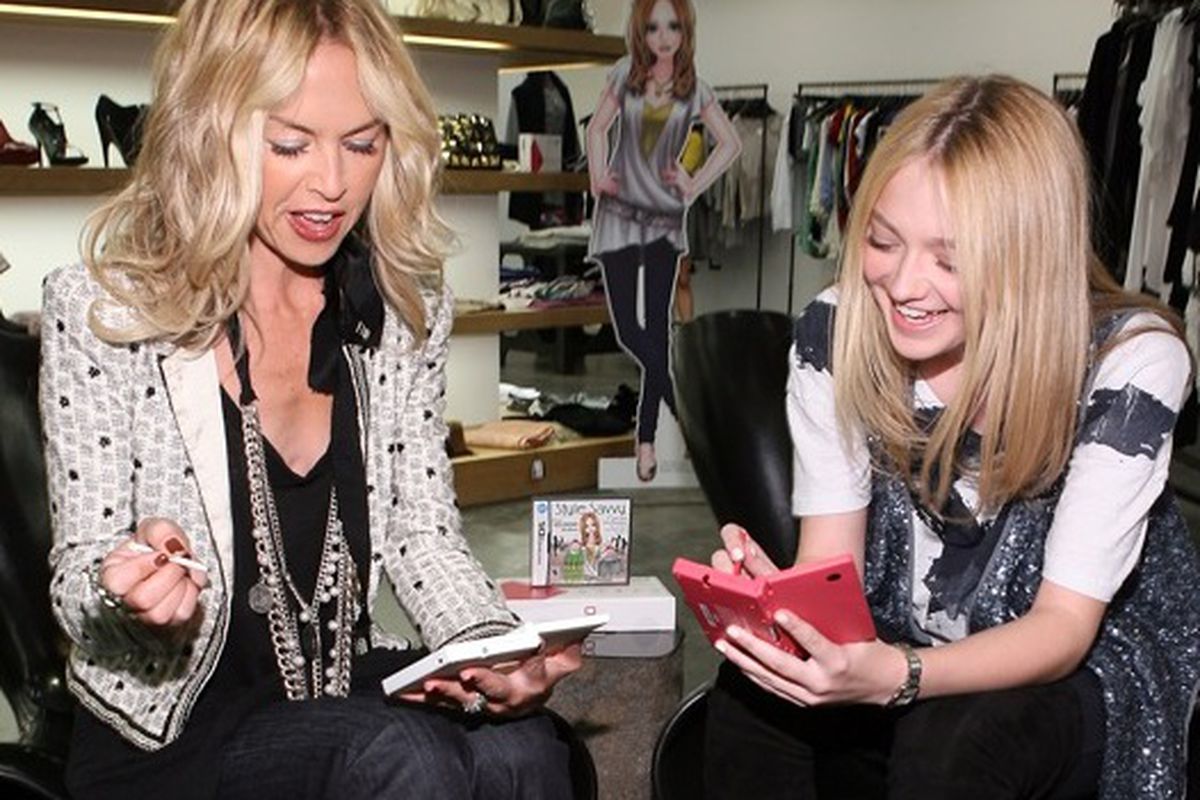 Who can concentrate on a game with all those fabulous shoes in the background? Image via <a href="http://latimesblogs.latimes.com/alltherage/2009/11/dakota-fanning-and-rachel-zoe-have-a-playdate-with-nintendo.html">All the Rage</a>