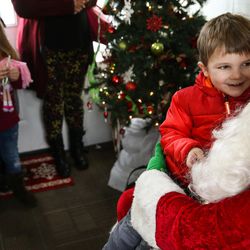 Kincaid Nielsen, 3, talks with Santa Claus at the Sugar House Santa Shack in Salt Lake City on Saturday, Nov. 26, 2016.