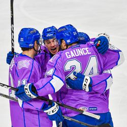 Syracuse Crunch players congratulate Cameron Gaunce (24) for his goal against the Laval Rocket in American Hockey League (AHL) action at the War Memorial Arena in Syracuse, New York on Saturday, November 17, 2018. Syracuse won 6-4.