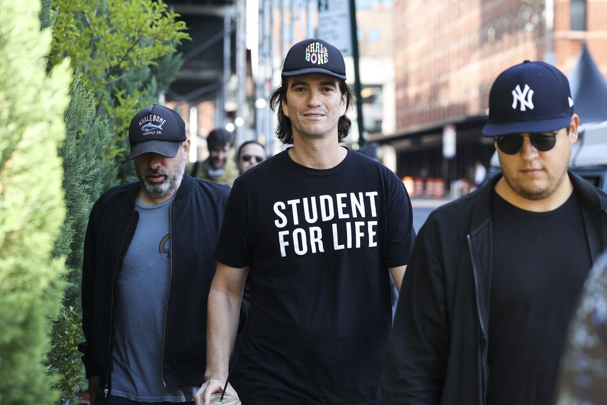 WeWork’s Adam Neumann wearing a T-shirt that says “STUDENT FOR LIFE”