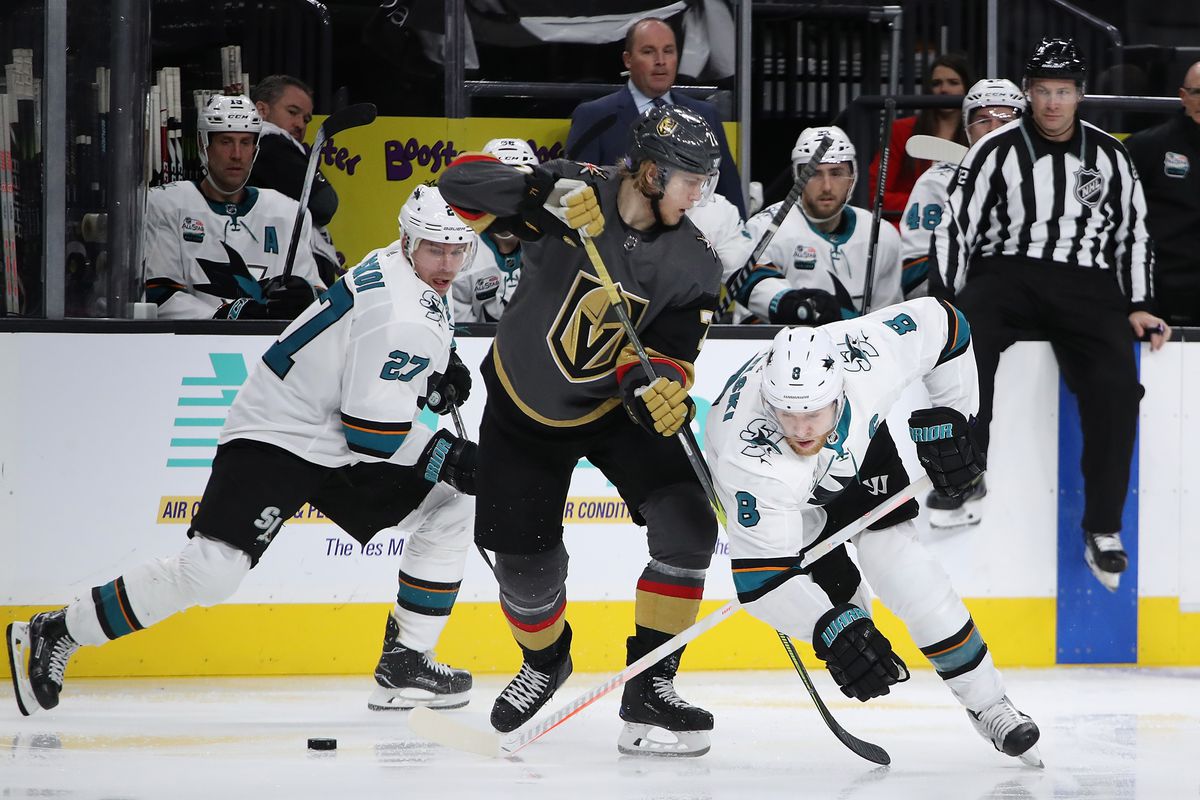 LAS VEGAS, NV - NOVEMBER 24: Joe Pavelski #8 of the San Jose Sharks and William Karlsson #71 of the Vegas Golden Knights skate for a loose puck during the second period at T-Mobile Arena on November 24, 2018 in Las Vegas, Nevada. The Golden Knights defeat