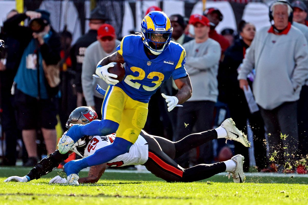 Los Angeles Rams running back Cam Akers (23) runs the ball against Tampa Bay Buccaneers cornerback Sean Murphy-Bunting (23) during the first half in a NFC Divisional playoff football game at Raymond James Stadium.&nbsp;