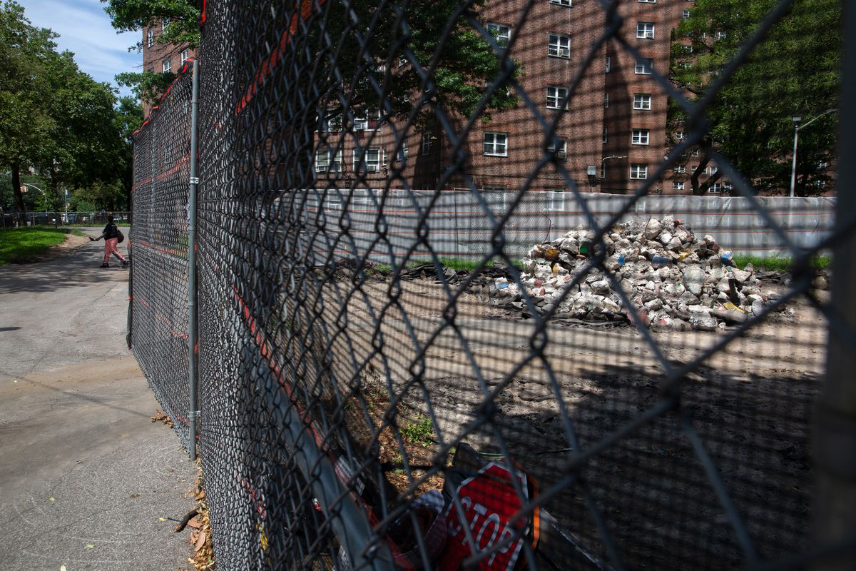 Workers were rebuilding a torn-up playground area inside the Albany Houses complex in Crown Heights, Brooklyn, July 14, 2021.