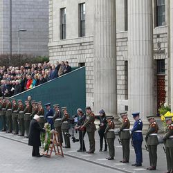 Irish President Michael D Higgins lays a wreath at the General Post Office on O'Connell street, Dublin, Ireland, Sunday, March, 27, 2016.  Thousands of soldiers marched solemnly Sunday through the crowded streets of Dublin to commemorate the 100th anniversary of Ireland's Easter Rising against Britain, a fateful rebellion that reduced parts of the capital to ruins and inspired the country's eventual independence. 