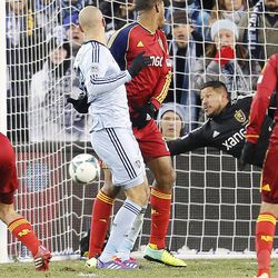 Real's Nick Rimando dives for and misses a shot by Sporting's Aurelien Collin as Real Salt Lake and Sporting KC play Saturday, Dec. 7, 2013 in MLS Cup action. Sporting KC won in a shootout.