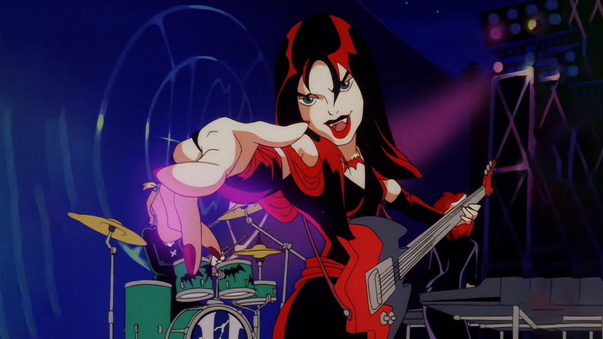 A goth girl playing a guitar and extending her hand to the audience