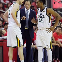 Utah Jazz head coach Quin Snyder talks with Utah Jazz forward Joe Ingles (2) and Utah Jazz guard Donovan Mitchell (45) as the Utah Jazz and the Houston Rockets play game two of the NBA playoffs at the Toyota Center in Houston on Wednesday, May 2, 2018.
