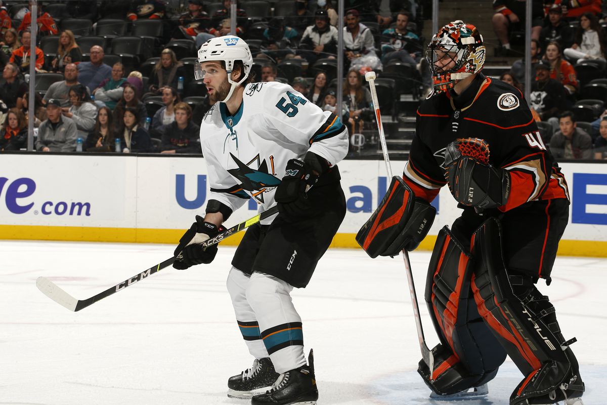 Scott Reedy #54 of the San Jose Sharks skates as Anthony Stolarz #41 of the Anaheim Ducks holds the crease during the game at Honda Center on March 6, 2022 in Anaheim, California.