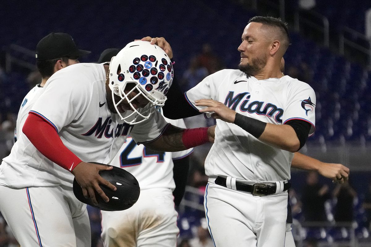 Miami Marlins teammates celebrate defeating the Pittsburgh Pirates after Miami Marlins first baseman Jesus Aguilar (99) scored the walk off game winning run on a wild pitch by Pittsburgh Pirates relief pitcher David Bednar (not pictured) at loanDepot park.