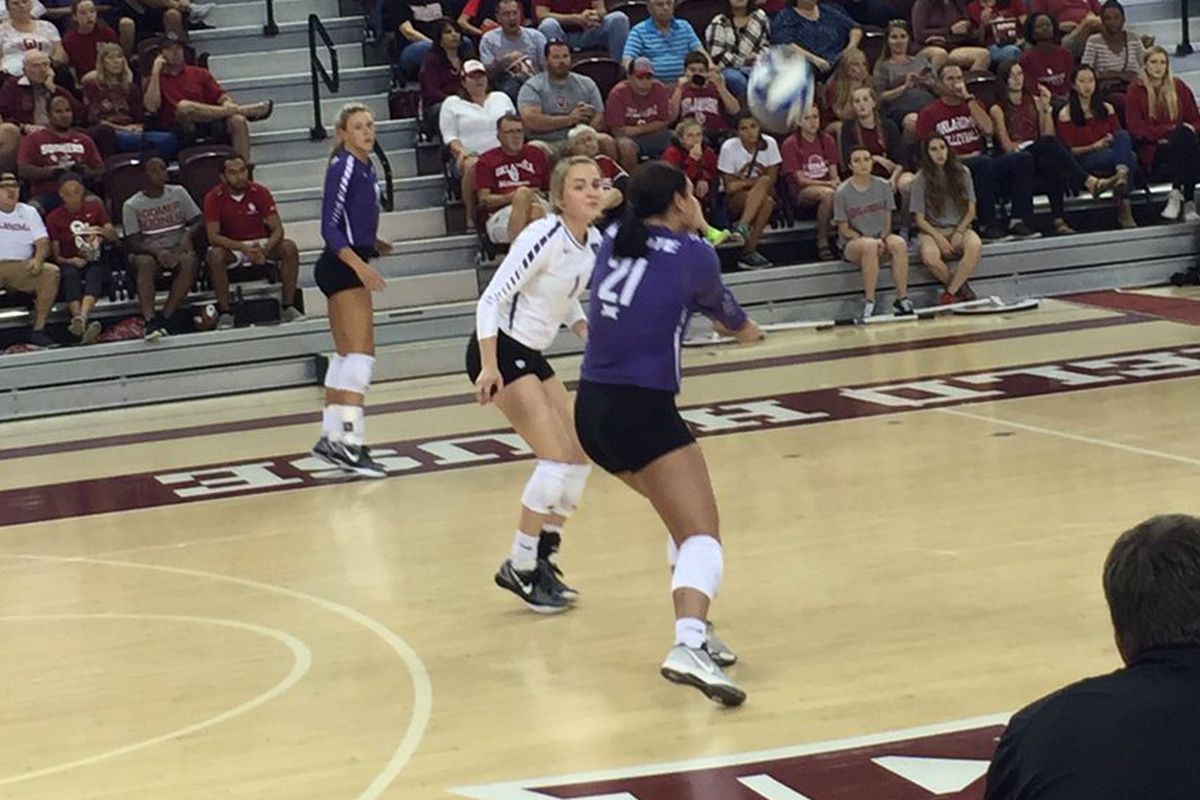 October 15, 2016: Kansas State Wildcats Brooke Sassin (17) and Kersten Kober (1) look on as Devan Fairfield (21) sets up an attack against the Oklahoma Sooners at McCasland Field House in Norman, Okla.