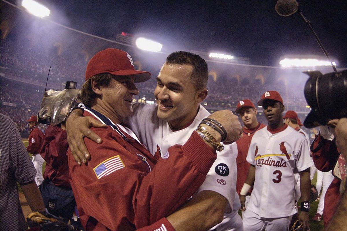 Cardinals manager Tony La Russa hugs infielder Miguel Cairo after the team won an NLDS game in 2002. Cairo will be La Russa’s bench coach with the White Sox in 2021.