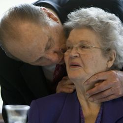 In the middle of President Thomas S. Monson's remarks at the new eight-story Zions Bank Financial Center on University Avenue in Provo, he stops to give his wife, Frances, a kiss on the cheek. His remarks Friday, May, 14, 2010, included a story about cheek kisses.