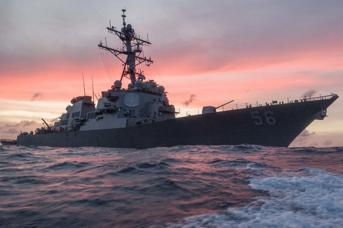In this Jan. 22, 2017, photo provided by U.S. Navy, the USS John S. McCain conducts a patrol in the South China Sea while supporting security efforts in the region. The guided-missile destroyer collided with a merchant ship on Monday, Aug. 21, in waters e