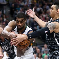 San Antonio Spurs guard Manu Ginobili (20), Utah Jazz forward Derrick Favors (15) and San Antonio Spurs guard Danny Green (14) fight for the rebound during a basketball game at the Vivint Smart Home Arena in Salt Lake City on Monday, Feb. 12, 2018. The Jazz won 101-99.