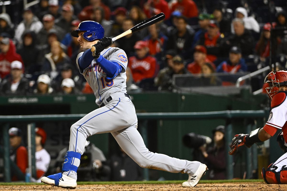New York Mets left fielder Mark Canha (19) hits an RBI single against the Washington Nationals during the sixth inning at Nationals Park.