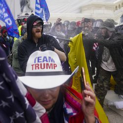 Supporters of President Donald Trump try to break through a police barrier on Wednesday, Jan. 6, 2021, at the Capitol in Washington.