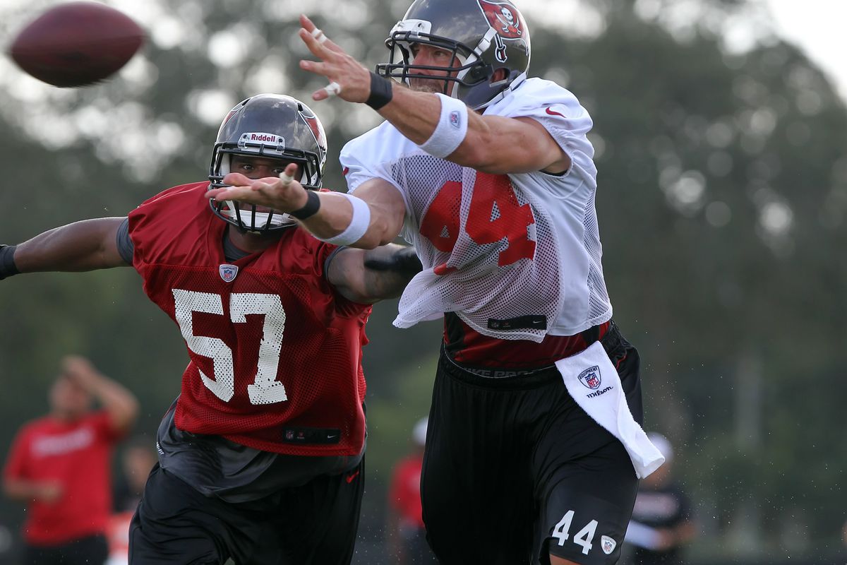 July 28, 2012; Tampa, FL, USA;  Tampa Bay Buccaneers tight end Dallas Clark (44) attempts to catch the ball as linebacker Adam Hayward (57) defends during training camp at One Buc Place. Mandatory Credit: Kim Klement-US PRESSWIRE