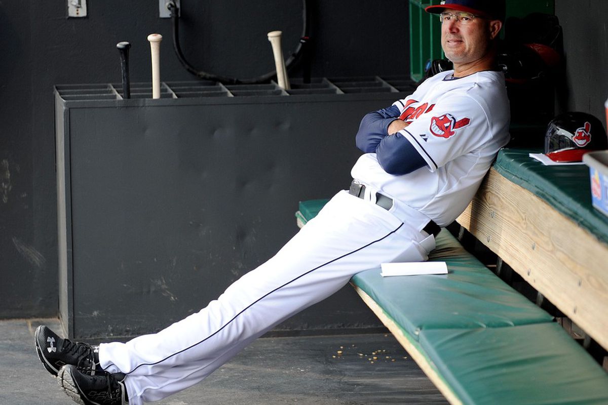 May 4, 2012; Cleveland, OH, USA: Cleveland Indians manager Manny Acta (11) sits in the dugout before the game against the Texas Rangers at Progressive Field.  Mandatory Credit: Eric P. Mull-USPRESSWIRE