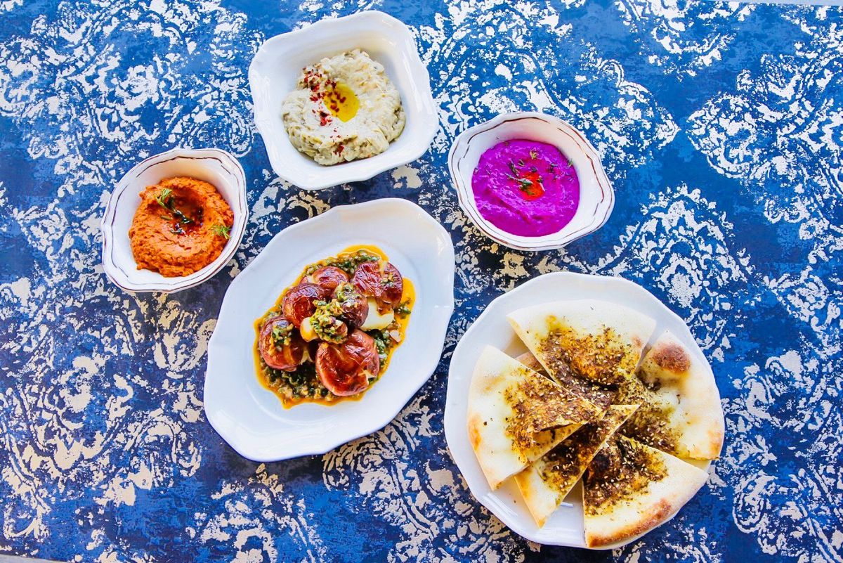 Overhead view of five colorful Eastern Mediterranean dishes