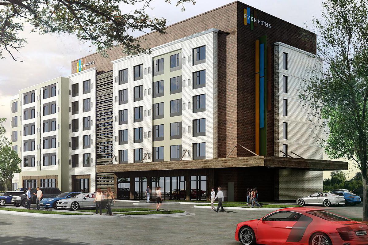 A rendering of the soon-to-open hotel, a heavily geometric building with wood paneling on the facade.