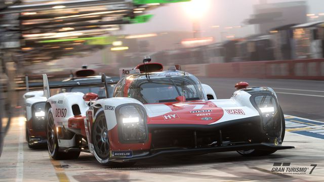 Two Toyota Le Mans cars race at speed in Gran Turismo 7
