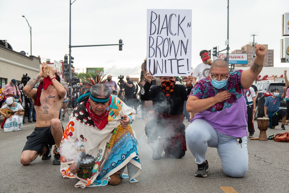 Protesters kneel to pay respect to George Floyd on 26th Street in Little Village on June 3, 2020.