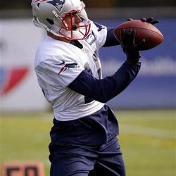 New England Patriots newly acquired wide receiver Austin Collie (10) catches a ball during a stretching and drills session before NFL football practice begins at the team's facility in Foxborough, Mass., Wednesday, Oct. 9, 2013. The Patriots host the New Orleans Saints on Sunday. (AP Photo/Stephan Savoia)