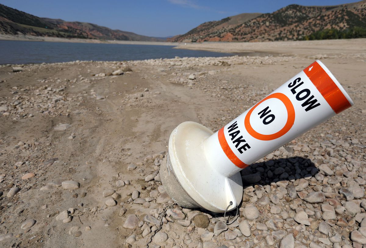 A marker buoy is grounded on the dried-up shore of Echo Reservoir on Sept. 16, 2021.