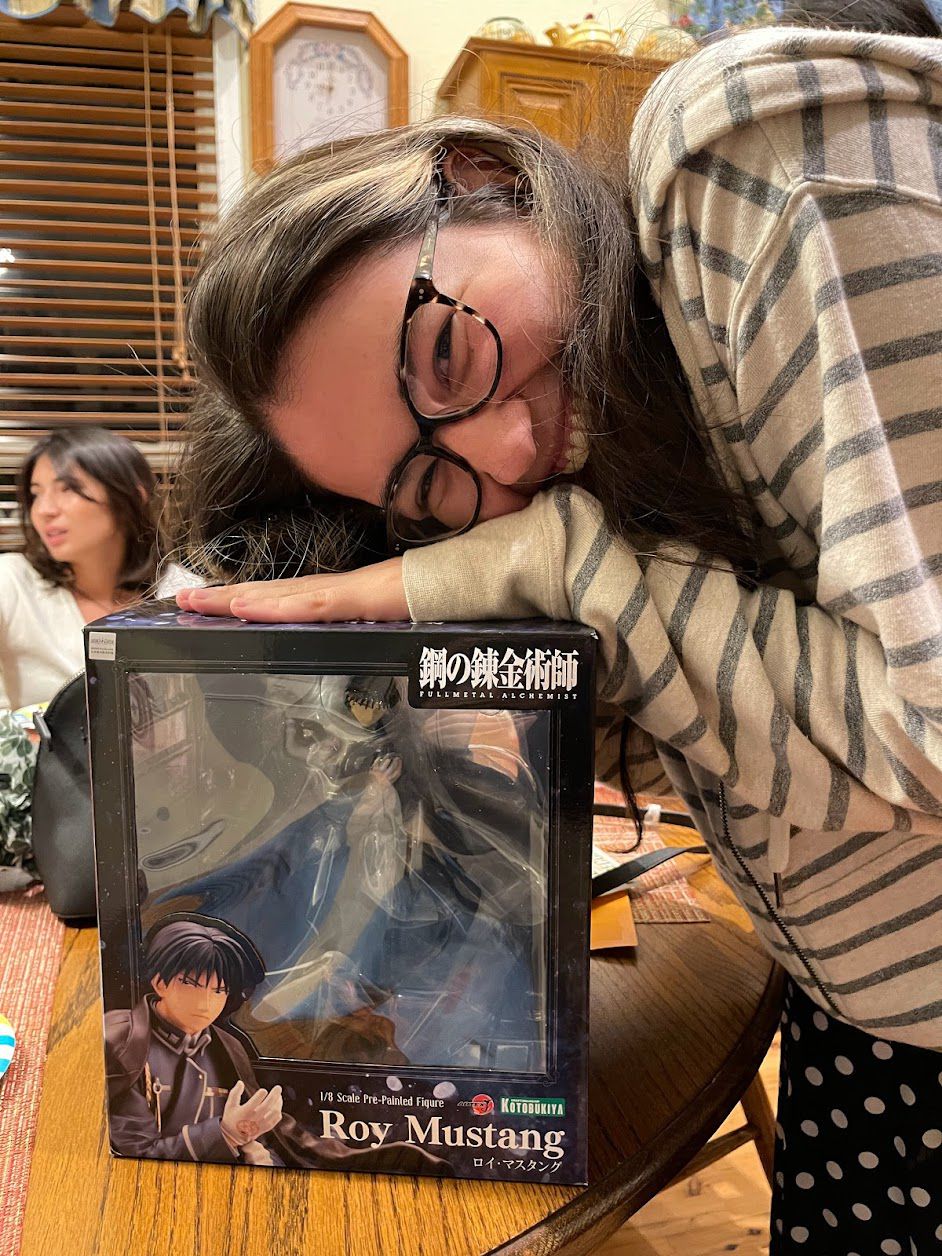 the author cooing over a figurine of roy mustang 