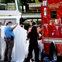 Emergency crews respond to an apartment complex near 850 W. 3900 South in Millcreek on Wednesday, Aug. 22, 2018. Police say a man kicked open the door of his estranged wife's apartment early Wednesday and beat her and their 13-year-old daughter with a crowbar, killing the woman and critically injuring his daughter.