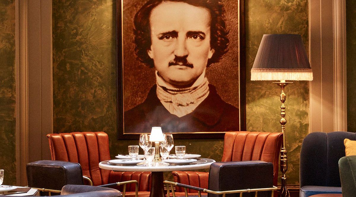 The Beekman Bar Room shows orange chairs and a portrait painting. 