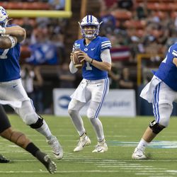 BYU quarterback Zach Wilson (1) drops back to pass during the second half of the team’s Hawaii Bowl NCAA college football game against Hawaii, Tuesday, Dec. 24, 2019, in Honolulu.
