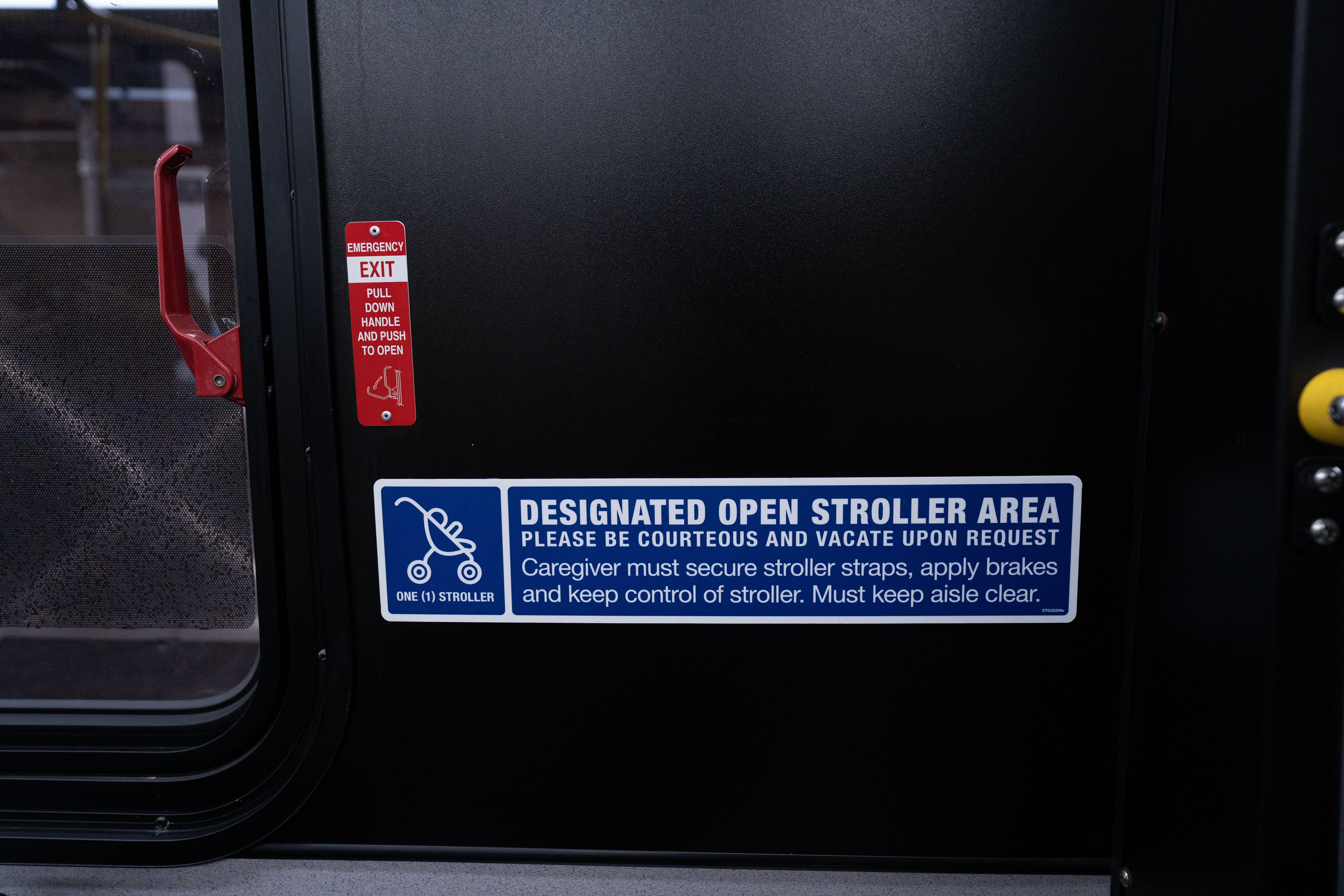 A decal designates the space for an open stroller on a city bus. Sept. 13, 2022.