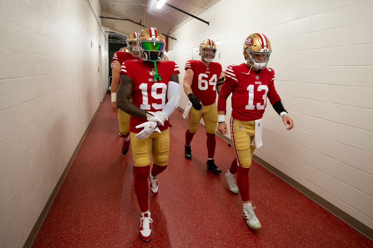 Brock Purdy and Deebo Samuel walking onto the field of the NFC Wild Card Playoffs - Seattle Seahawks v San Francisco 49ers