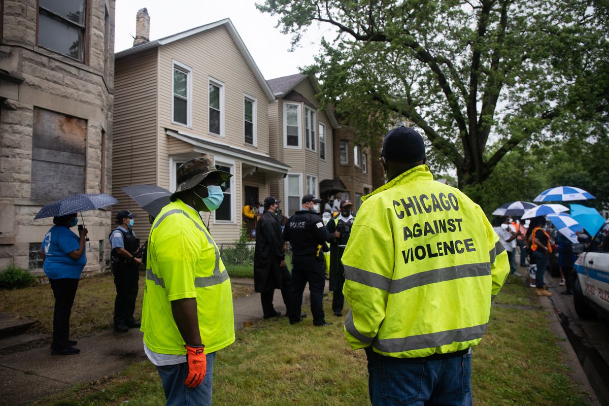City workers and police officers attend a press conference in West Woodlawn Friday morning, July 10, 2020. Chicago Police Department announced the launch of “Summer Mobile Patrol,” a collaborative, community policing effort among police, other city agencies and community members.