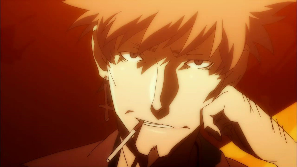 Oshino, a man with a small goatee and red hair, rests his head on his fist and dangles a cigarette out of his mouth. He is wearing an earring in the shape of an upside down cross.