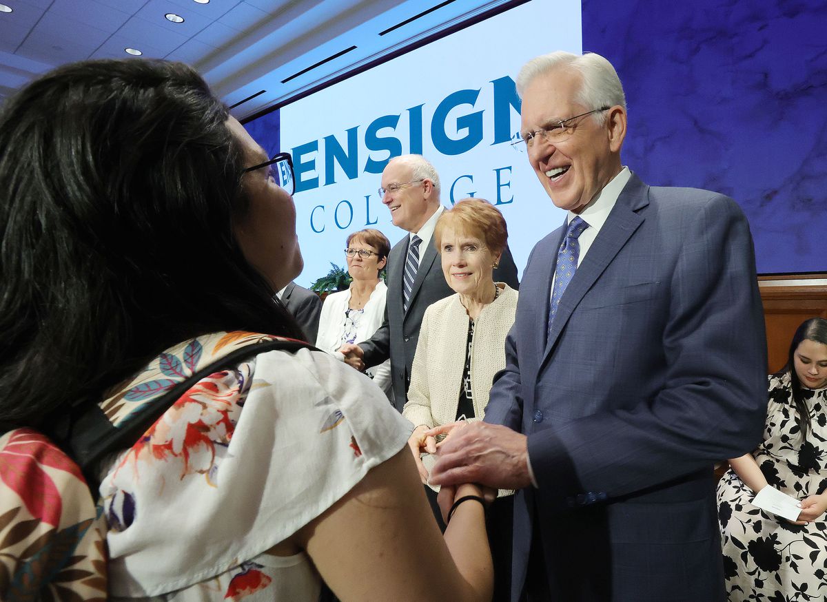 Elder D. Todd Christofferson, of the Quorum of the Twelve Apostles, and his wife, Sister Kathy Christofferson, greet a student.