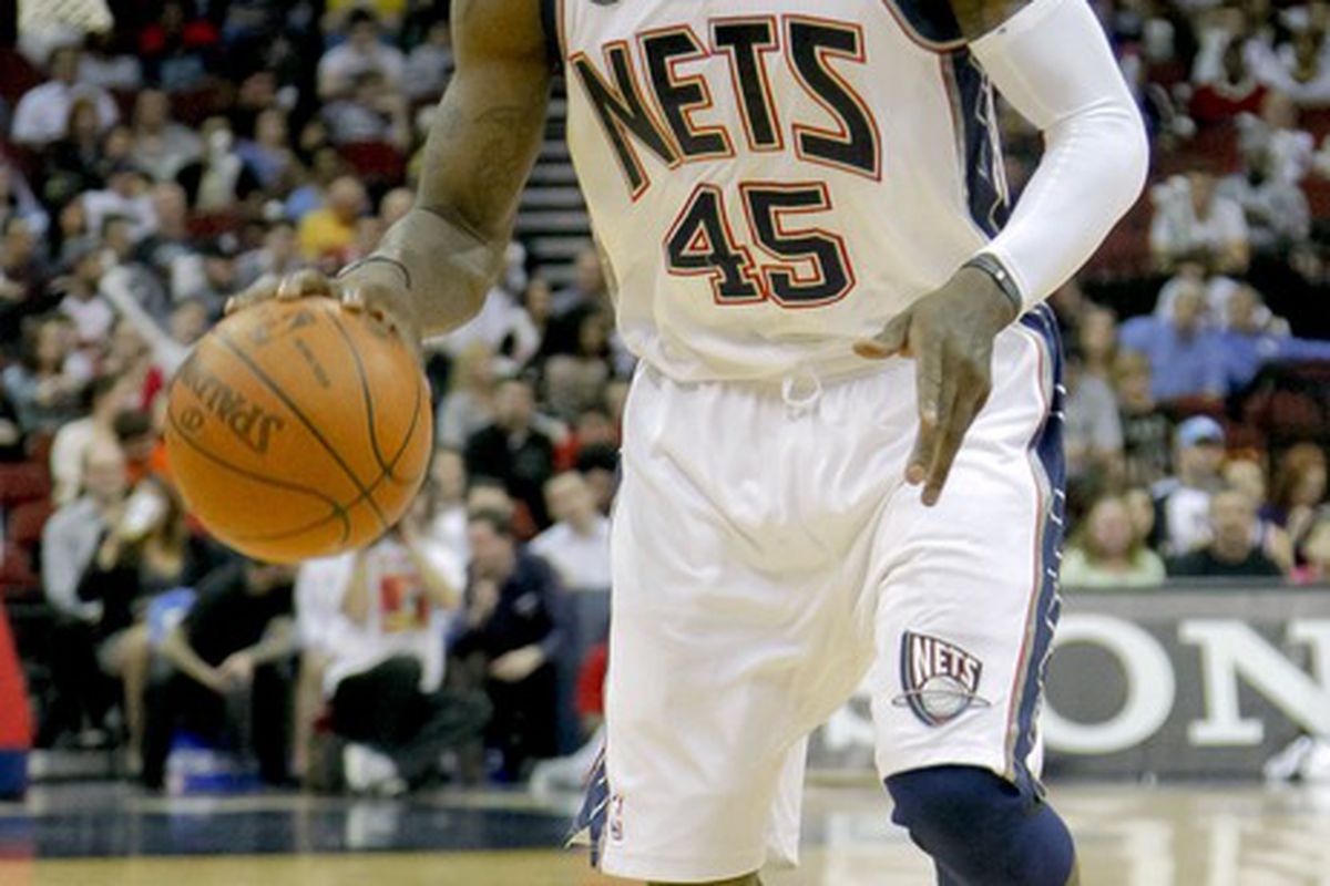 Mar 21, 2012; Newark, NJ, USA;  New Jersey Nets small forward Gerald Wallace (45) controls the ball during the game against the Washington Wizards at the Prudential Center. The Wizards won 108-89. Mandatory Credit: Jim O'Connor-US PRESSWIRE