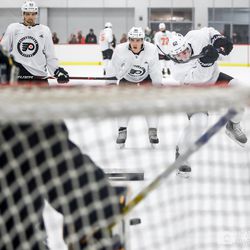 Jay O’Brien (C) practices accuracy with a goalie during development camp
