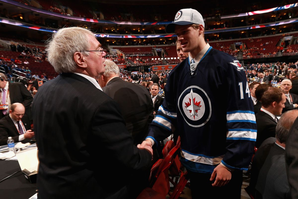 Matt Ustaski meets with Winnipeg management after being selected in the 7th round. 