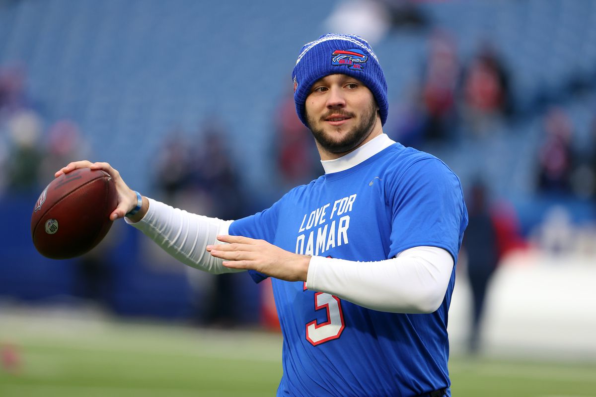Quarterback Josh Allen #17 of the Buffalo Bills warms up wearing a Damar Hamlin shirt prior to the game against the New England Patriots at Highmark Stadium on January 08, 2023 in Orchard Park, New York.