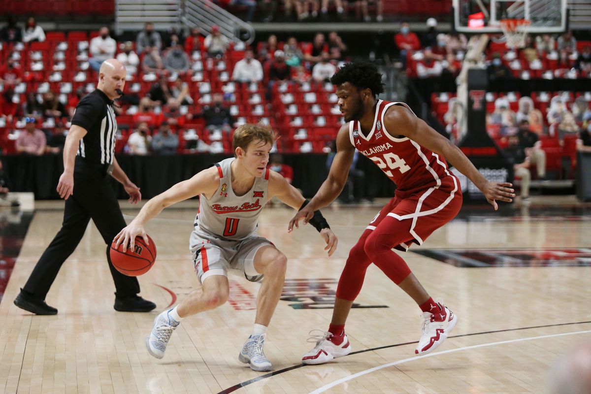 Texas Tech Red Raiders guard Mac McClung works the ball against Oklahoma Sooners guard Elijah Harkless in the first half at United Supermarkets Arena.