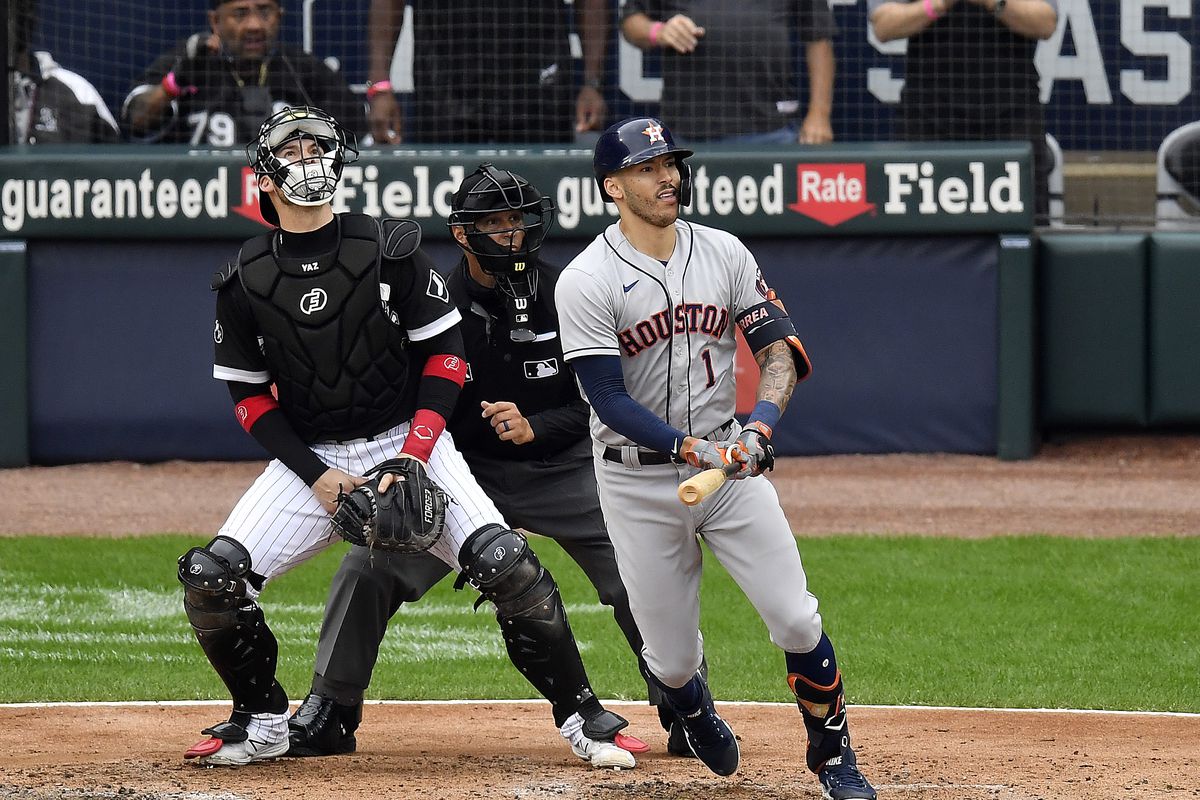 Carlos Correa #1 of the Houston Astros hits a two-run double during the 3rd inning of Game 4 of the American League Division Series against the Chicago White Sox at Guaranteed Rate Field on October 12, 2021 in Chicago, Illinois.