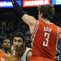 Utah Jazz center Enes Kanter (0) works his way to the basket around Houston Rockets center Omer Asik (3) during a game at EnergySolutions Arena on Monday, Dec. 2, 2013.