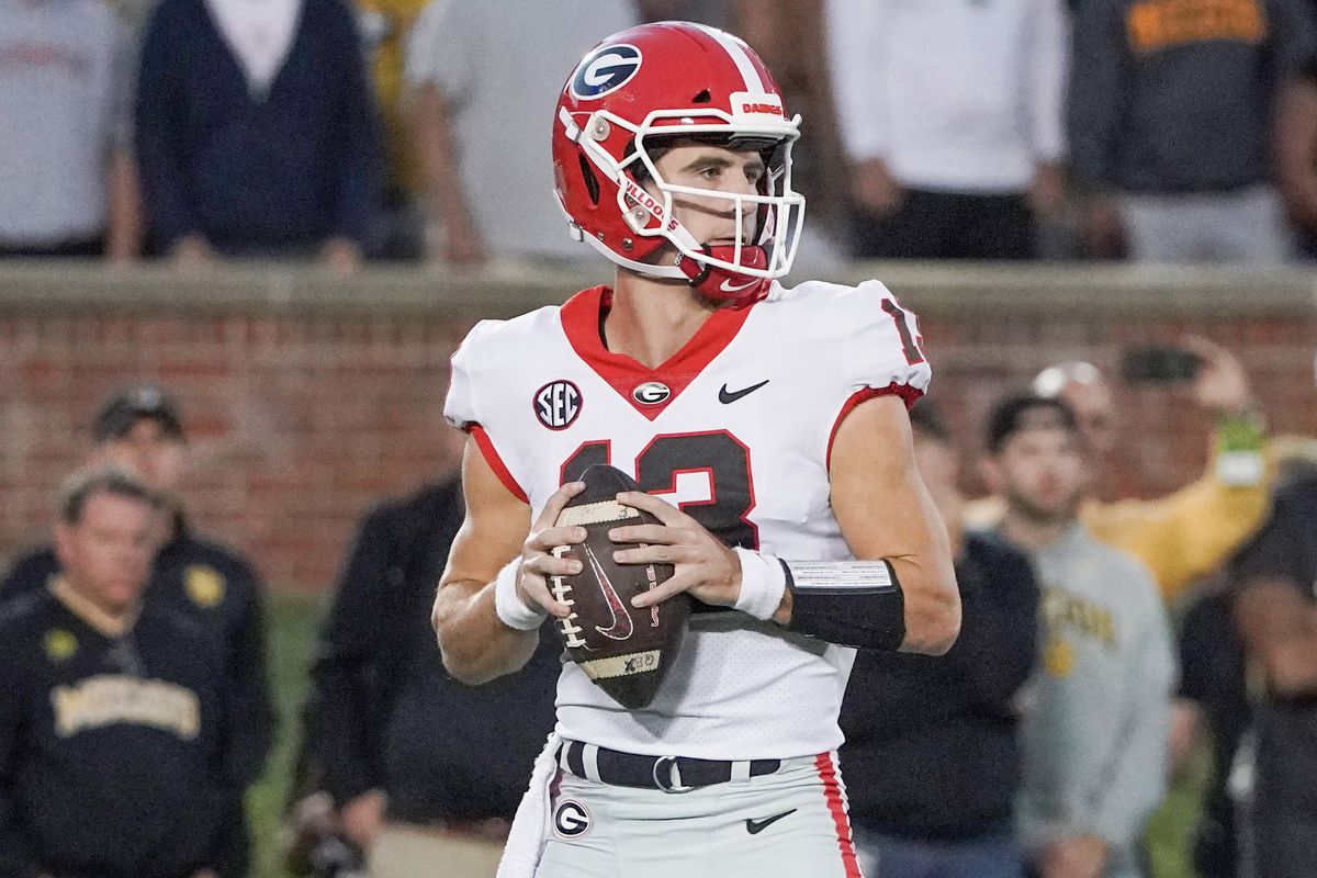 Georgia Bulldogs quarterback Stetson Bennett drops back to pass against the Missouri Tigers during the first half at Faurot Field at Memorial Stadium.