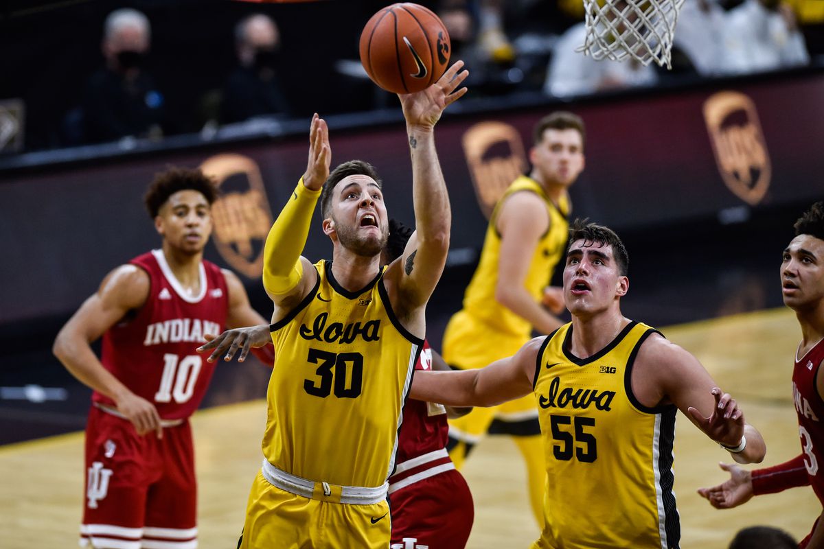 Iowa Hawkeyes guard Connor McCaffery goes to the basket as center Luka Garza looks on during the first half against the Indiana Hoosiers at Carver-Hawkeye Arena.&nbsp;